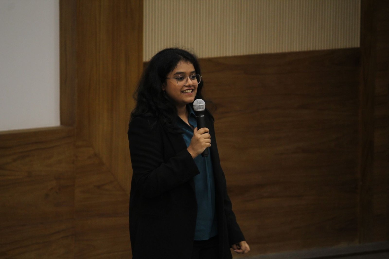 Anjali Laddha speaking to an audience