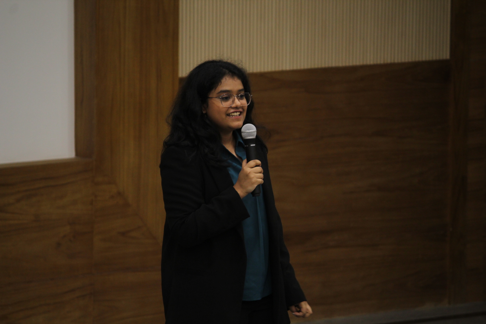 Anjali Laddha speaking to an audience